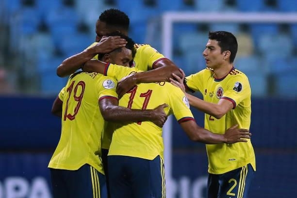 Miguel Borja of Colombia celebrates with teammates Yerry Mina, Juan Cuadrado and Stefan Medina after scoring the first goal of his team during a...