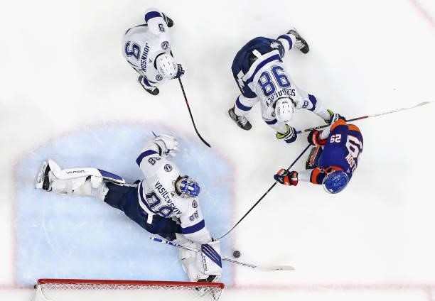 Andrei Vasilevskiy of the Tampa Bay Lightning defends against Brock Nelson of the New York Islanders in Game Four of the Stanley Cup Semifinals...
