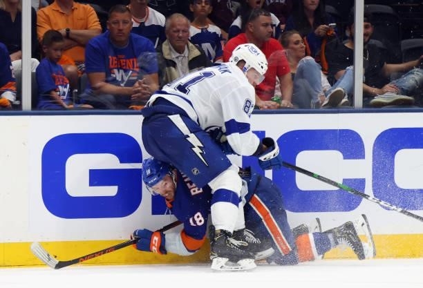 Erik Cernak of the Tampa Bay Lightning checks Anthony Beauvillier of the New York Islanders in Game Four of the Stanley Cup Semifinals during the...