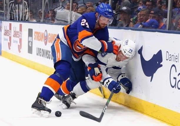 Scott Mayfield of the New York Islanders checks Ross Colton of the Tampa Bay Lightning in Game Four of the Stanley Cup Semifinals during the 2021...