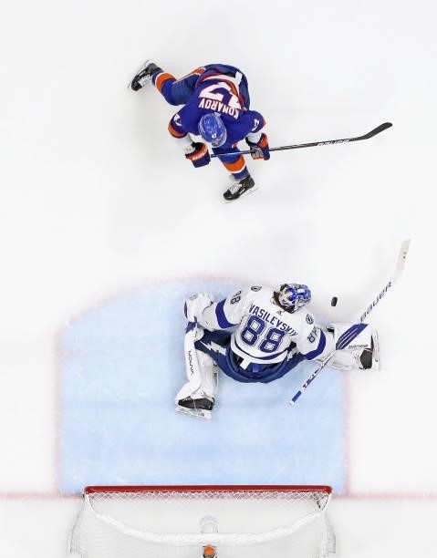 Andrei Vasilevskiy of the Tampa Bay Lightning defends against Leo Komarov of the New York Islanders in Game Four of the Stanley Cup Semifinals during...