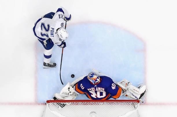 Semyon Varlamov of the New York Islanders defends against Brayden Point of the Tampa Bay Lightning in Game Four of the Stanley Cup Semifinals during...