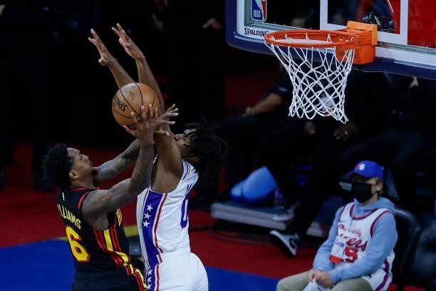 Lou Williams of the Atlanta Hawks is fouled by Tyrese Maxey of the Philadelphia 76ers during the second quarter during Game Seven of the Eastern...