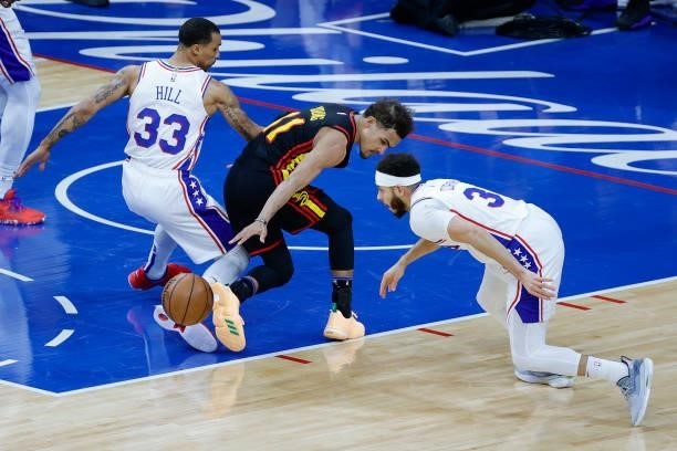Trae Young of the Atlanta Hawks loses possession during the second quarter against the Philadelphia 76ers during Game Seven of the Eastern Conference...