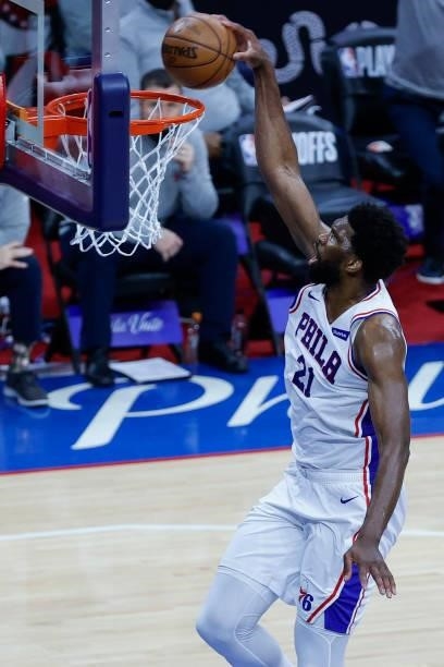 Joel Embiid of the Philadelphia 76ers dunks during the second quarter against the Atlanta Hawks during Game Seven of the Eastern Conference...