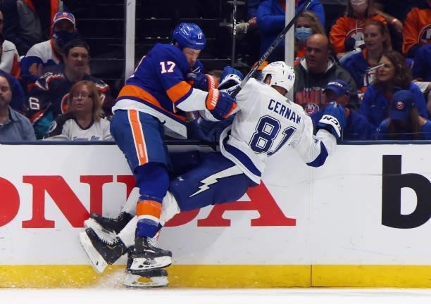 Erik Cernak of the Tampa Bay Lightning left the ice following this check by Matt Martin of the New York Islanders in Game Four of the Stanley Cup...