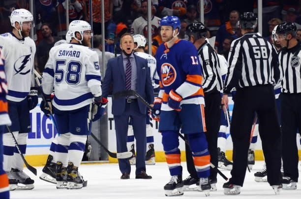 Head coach Jon Cooper of the Tampa Bay Lightning speaks with a referee during the game against the New York Islanders in Game Four of the Stanley Cup...