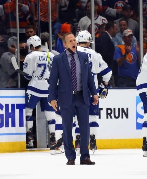 Head coach Jon Cooper of the Tampa Bay Lightning speaks with a referee during the game against the New York Islanders in Game Four of the Stanley Cup...