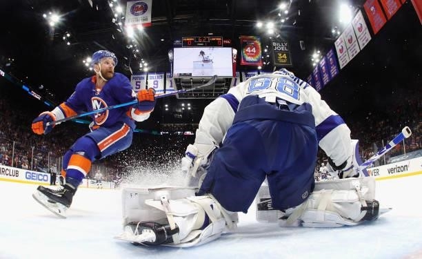 Andrei Vasilevskiy of the Tampa Bay Lightning defends against Leo Komarov of the New York Islanders in Game Four of the Stanley Cup Semifinals during...