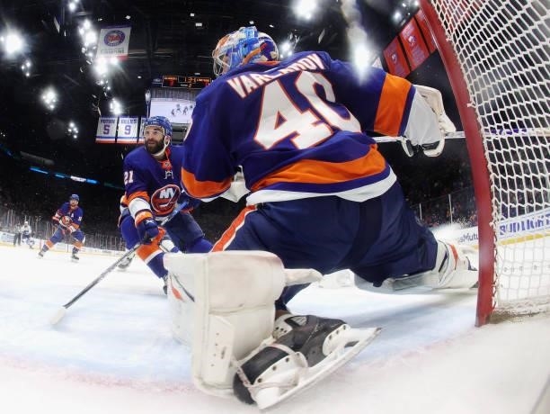 Kyle Palmieri and Semyon Varlamov of the New York Islanders defend against the Tampa Bay Lightning in Game Four of the Stanley Cup Semifinals during...