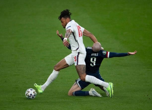 Tyrone Mings of England and Lyndon Dykes of Scotland in action during the UEFA Euro 2020 Championship Group D match between England and Scotland at...
