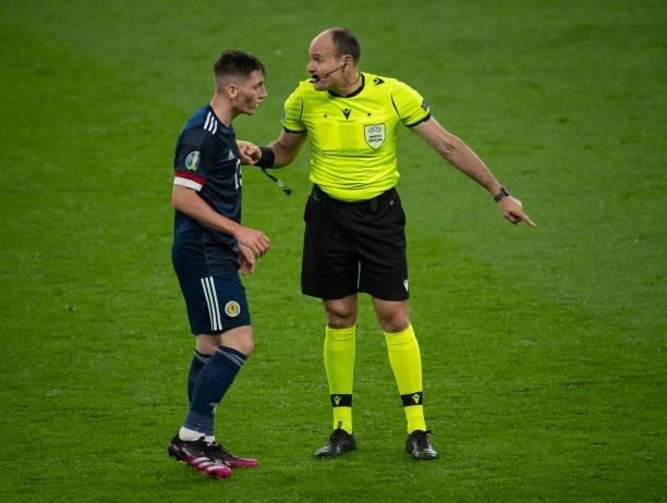 Referee Antonio Mateu Lahoz discusses a decision with Billy Gilmour of Scotland during the UEFA Euro 2020 Championship Group D match between England...