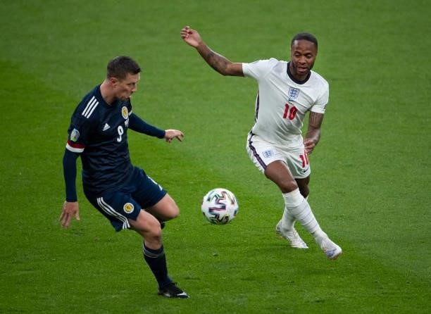 Raheem Sterling of England and Callum McGregor of Scotland in action during the UEFA Euro 2020 Championship Group D match between England and...