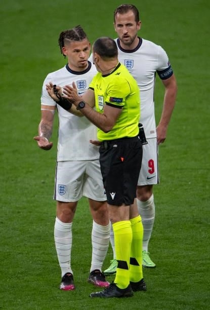 Referee Antonio Mateu Lahoz discusses a decision with Kalvin Phillips of England with Harry Kane looking on during the UEFA Euro 2020 Championship...