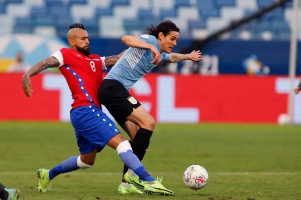 Arturo Vidal of Chile competes for the ball with Edinson Cavani of Uruguay during a group A match between Uruguay and Chile as part of Conmebol Copa...