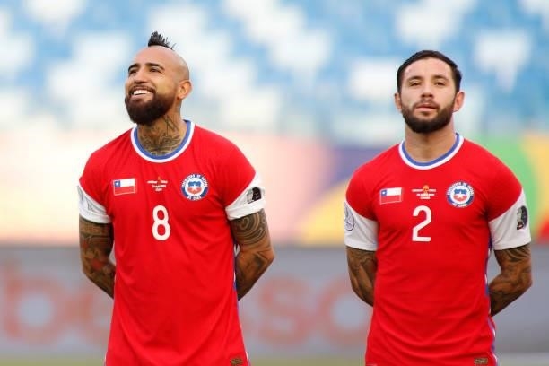 Arturo Vidal of Chile smiles next to his teammate Eugenio Mena before a group A match between Uruguay and Chile as part of Conmebol Copa America...
