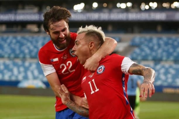 Eduardo Vargas of Chile celebrates with teammate Ben Brereton after scoring the first goal of his team during a group A match between Uruguay and...