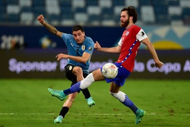 Jose Gimenez of Uruguay competes for the ball with Ben Brereton of Chile during a group A match between Uruguay and Chile as part of Conmebol Copa...