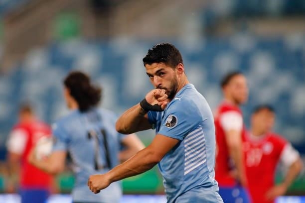 Luis Suarez of Uruguay celebrates after his team first goal scored by an own goal of Arturo Vidal of Chile during a group A match between Uruguay and...