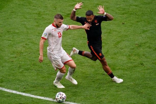 Stefan Ristovski of North Macedonia and Memphis Depay of the Netherlands during the UEFA Euro 2020 Championship Group C match between North Macedonia...