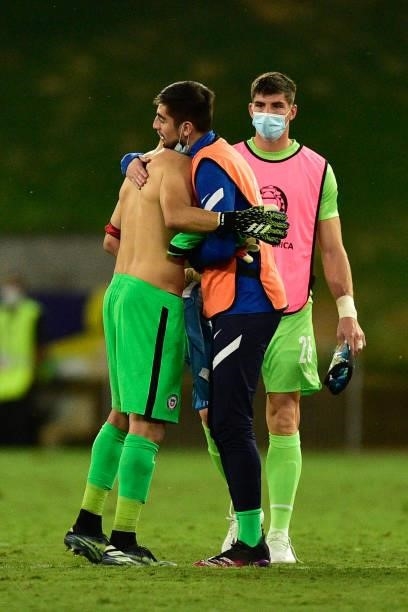 Claudio Bravo goalkeeper of Chile greets teammate after a group A match between Uruguay and Chile as part of Conmebol Copa America Brazil 2021 at...