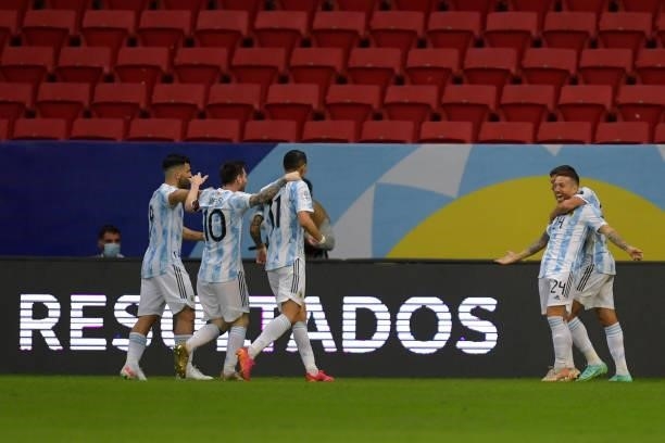 Alejandro Gomez of Argentina celebrates with teammates after scoring the first goal of his team during a group A match between Argentina and Paraguay...