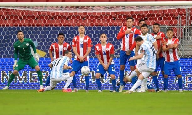 Lionel Messi of Argentina shoots a free kick during a group A match between Argentina and Paraguay as part of Conmebol Copa America Brazil 2021 at...