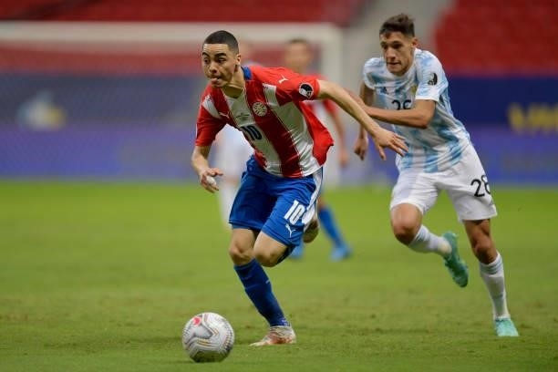 Miguel Almiron of Paraguay competes for the ball with Nahuel Molina of Argentina during a group A match between Argentina and Paraguay as part of...