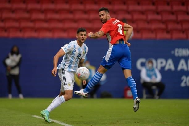 Cristian Romero of Argentina competes for the ball with Gabriel Avalos of Paraguay during a group A match between Argentina and Paraguay as part of...