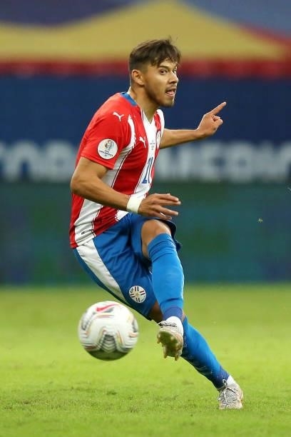 Oscar Romero of Paraguay kicks the ball during a group A match between Argentina and Paraguay as part of Conmebol Copa America Brazil 2021 at Mane...