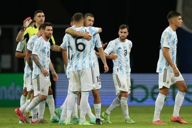 Lionel Messi of Argentina celebrates with teammates German Pezzella and Guido Rodriguez after winning a group A match between Argentina and Paraguay...