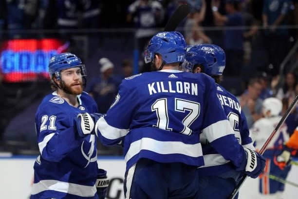 Brayden Point of the Tampa Bay Lightning is congratulated by Alex Killorn after scoring a goal against the New York Islanders during the third period...