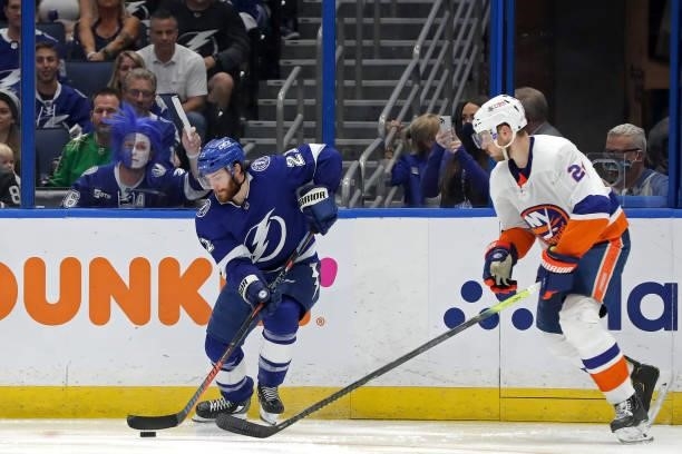 Brayden Point of the Tampa Bay Lightning is defended by Scott Mayfield of the New York Islanders during the third period in Game Five of the Stanley...