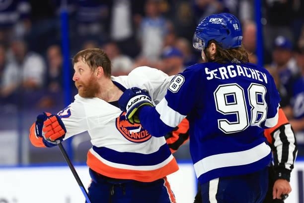 Leo Komarov of the New York Islanders and Mikhail Sergachev of the Tampa Bay Lightning scuffle during the third period in Game Five of the Stanley...