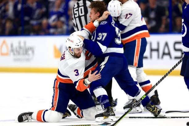 Adam Pelech of the New York Islanders and Yanni Gourde of the Tampa Bay Lightning scuffle during the third period in Game Five of the Stanley Cup...