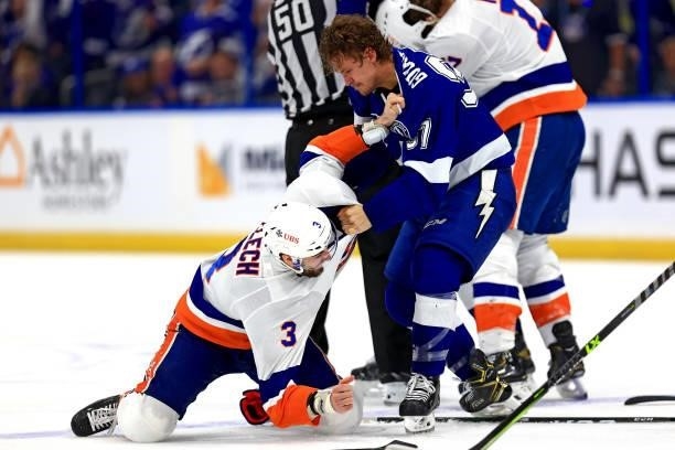 Adam Pelech of the New York Islanders and Yanni Gourde of the Tampa Bay Lightning scuffle during the third period in Game Five of the Stanley Cup...