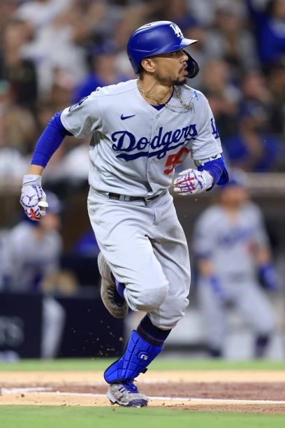 Mookie Betts of the Los Angeles Dodgers runs to first base after hitting a solo homerun during the third inning of a game against the San Diego...