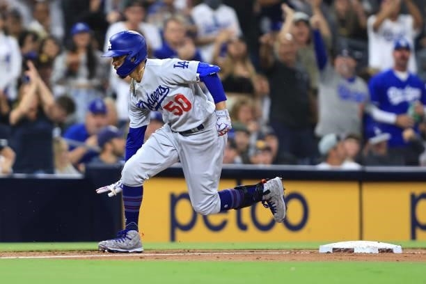 Mookie Betts of the Los Angeles Dodgers rounds third base after hitting a solo homerun during the third inning of a game against the San Diego Padres...