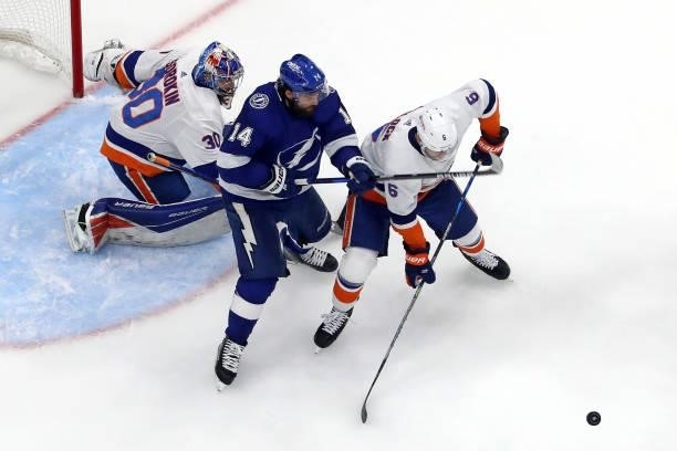 Pat Maroon of the Tampa Bay Lightning and Ryan Pulock of the New York Islanders battle for the puck in Game Five of the Stanley Cup Semifinals during...