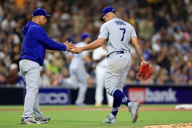 Manager Dave Roberts relieves Julio Urias of the Los Angeles Dodgers during the fifth inning of a game against the San Diego Padres at PETCO Park on...