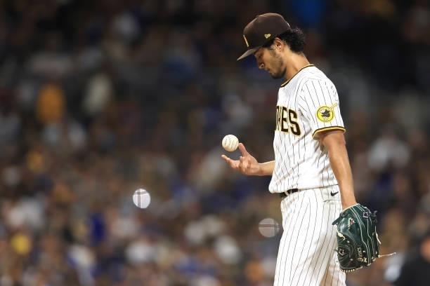 Yu Darvish of the San Diego Padres looks on after recording his 1500th strikeout during the sixth inning of a game against the Los Angeles Dodgers at...