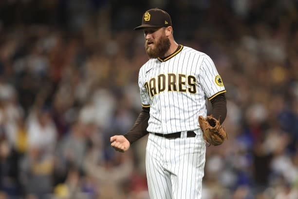 Austin Adams of the San Diego Padres does a small dance after retiring the side during the seventh inning of a game against the Los Angeles Dodgers...