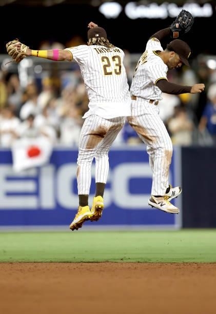 Fernando Tatis Jr. #23 and Trent Grisham of the San Diego Padres celebrate after defeating the Los Angeles Dodgers 6-2 in a game at PETCO Park on...