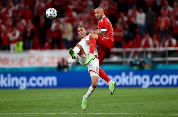 Yussuf Poulsen of Denmark battles for possession with Fedor Kudryashov of Russia during the UEFA Euro 2020 Championship Group B match between Russia...