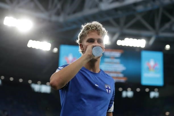 Onni Valakari of Finland drinks water during his warm up before the UEFA Euro 2020 Championship Group B match between Finland and Belgium at Saint...
