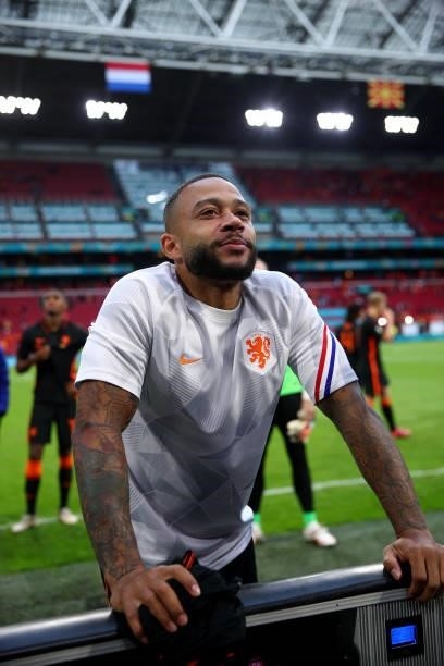 Memphis Depay of Netherlands waves and talks to his family after the match during the UEFA Euro 2020 Championship Group C match between North...