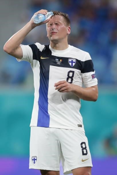 Robin Lod of Finland pours water over his face during the UEFA Euro 2020 Championship Group B match between Finland and Belgium at Saint Petersburg...