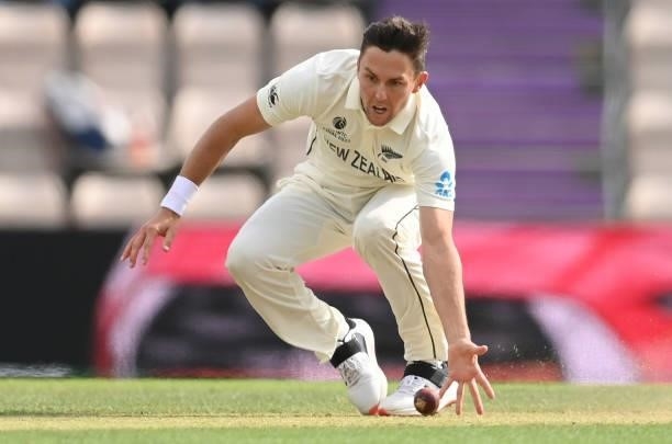 Trent Boult of New Zealand fields off his own bowling during Day 5 of the ICC World Test Championship Final between India and New Zealand at The...