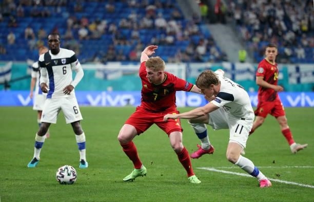 Kevin De Bruyne of Belgium battles for the ball with Rasmus Schuller of Finland during the UEFA Euro 2020 Championship Group B match between Finland...