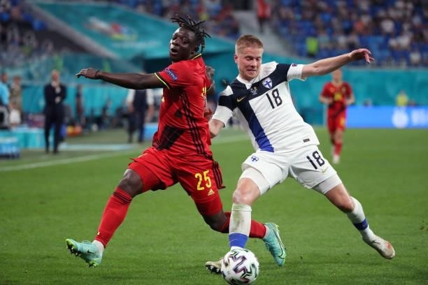 Jeremy Doku of Belgium battles for the ball with Jere Uronen of Finland during the UEFA Euro 2020 Championship Group B match between Finland and...